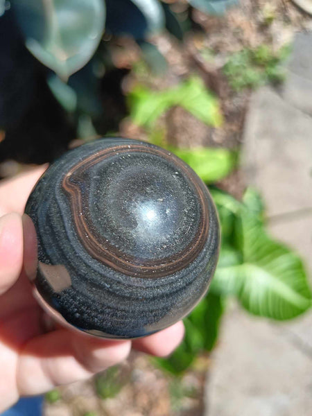 Black Obsidian Crystal Sphere with iron inclusion