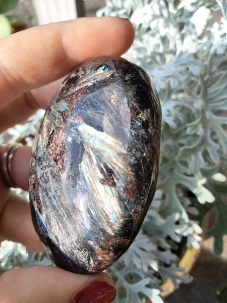 Astrophilite Palmstone Garnet inclusions with flash